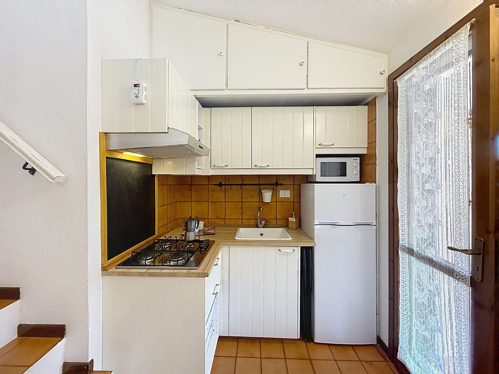 Fridge, microwave, cookware/dishes/utensils