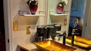 A bathroom with a large mirror, a vessel sink, and a coffee maker. - La Paloma Mountain Suite nestled within an estate in Tucson’s Catalina Foothills (Tucson)