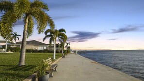 Terrace/patio - A Luxurious 4BR/4BA waterfront wellness retreat with saltwater pool, sauna, cold plunge (Cape Coral)