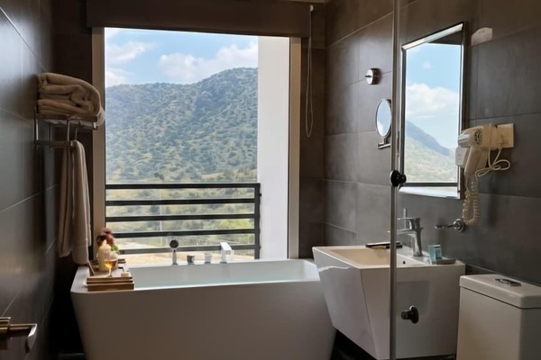 Deluxe Double Room, Balcony, Mountain View | Bathroom | Combined shower/tub, hair dryer, slippers, towels