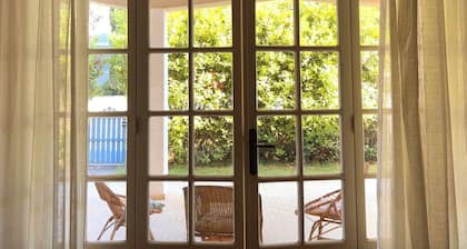 Cottage with large patio and bike path that connects directly to the waterfront