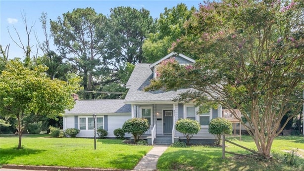 A single-story house with a front porch, a small front yard, and a driveway. - Private 2BR Apartment w/ Private Entrance – Entire Upstairs Unit (Portsmouth)