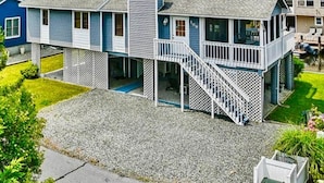 A two-story house with a balcony and a covered porch. - Waterfront, Dock, Deck, Walk to the Beach, bring your kayaks/boat! (South Bethany)