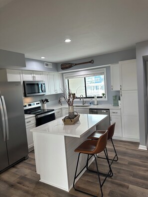 Private kitchen - Slip into Sunset: On the water, boat SLIP, SUNSET views, steps from beach, pool! (Carolina Beach)