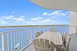 Outdoor dining - 3 BR 3 BA spacious condo ~Gulf Shores~Private Beach~Pools~Gulf & Lagoon Views (Gulf Shores)