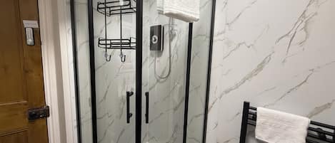 Shower, hair dryer, towels, soap