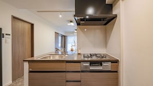 Deluxe Room, Non Smoking (B) | Private kitchen | Full-sized fridge, microwave, stovetop, electric kettle - Apartment Hotel 11 Osaka Tenmangu (Osaka)