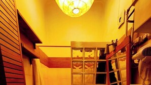 A compact bathroom with a shower, toilet, and sink. - Wooden loft with balcony (metro and services under the house) sleeps 4 (Milano)