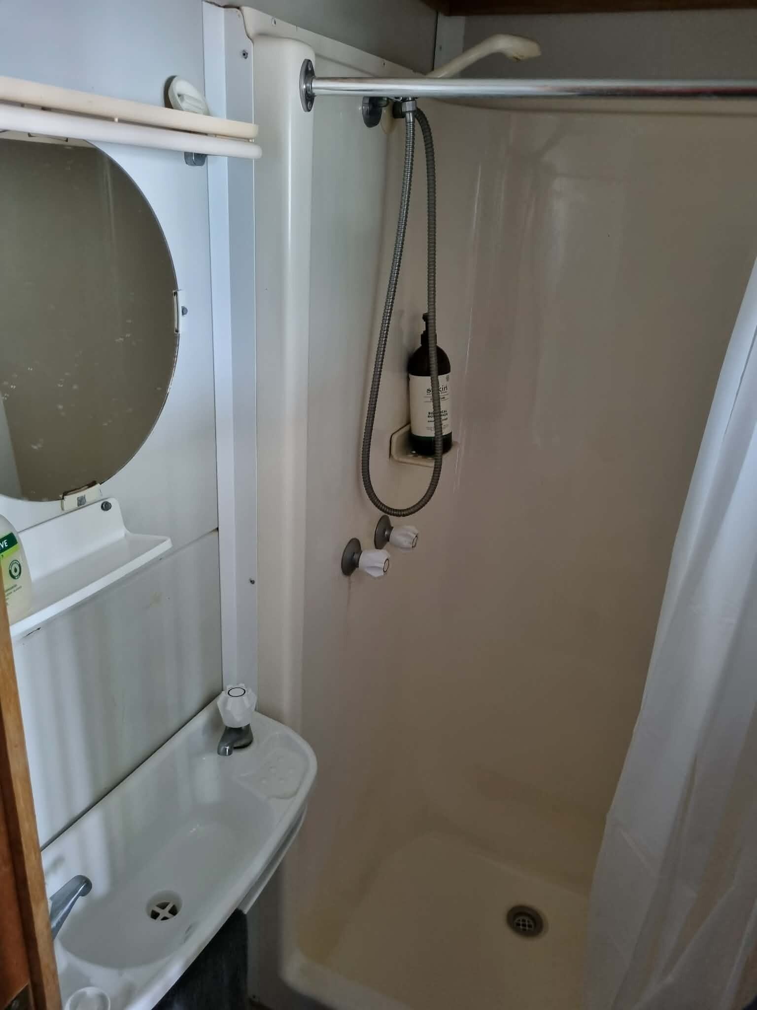 Shower, eco-friendly toiletries, towels, soap