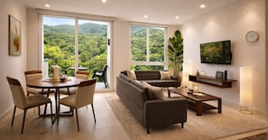 A modern living room with a sofa, coffee table, dining table with chairs, and a TV mounted on the wall. - Vista Tower, Apartamento 3 hab. piscina, gym, rooftop (San Salvador)