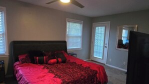 A bedroom with a bed, a ceiling fan, and a window with blinds. - Masters Week Golf Retreat-4BR Home on Golf Course (Augusta)