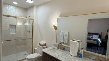 Shower, towels, soap, toilet paper