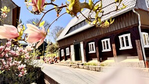 A traditional wooden building with multiple windows and a sloped roof. - NEU!   dasErbhaus by Interhome (Grossschönau)