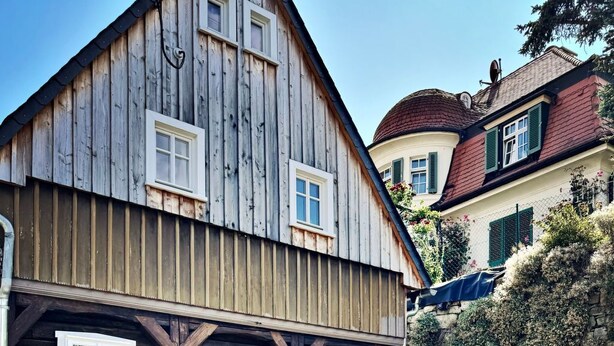 A traditional wooden building with a steeply pitched roof and a stone pathway leading to its entrance. - NEU!   dasErbhaus by Interhome (Grossschönau)