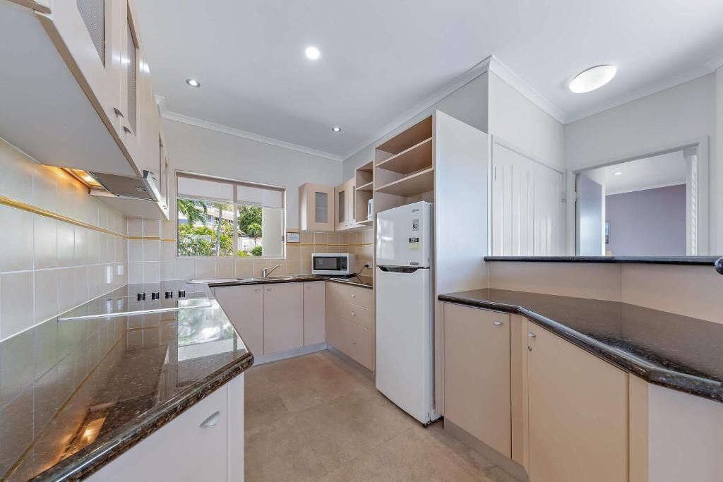 Full-sized fridge, microwave, toaster, cleaning supplies