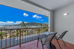 Basic Apartment, 1 King Bed, Balcony, Sea View | Outdoor dining - Spa Haven 18B Top Floor In Room Spa (Airlie Beach)
