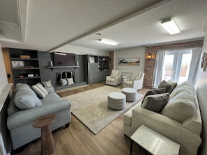Smart TV, fireplace, books