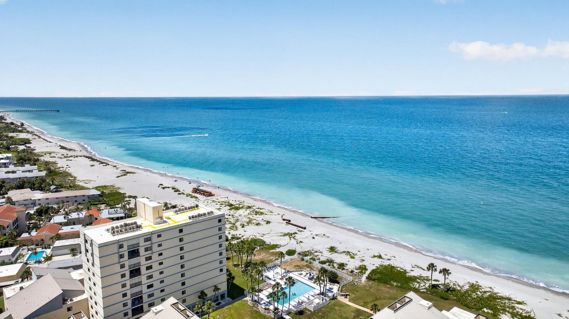 A coastal hotel with a pool, beach access, and ocean views.