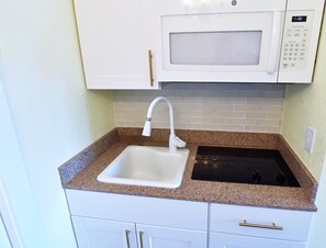 Fridge, microwave, stovetop, coffee/tea maker