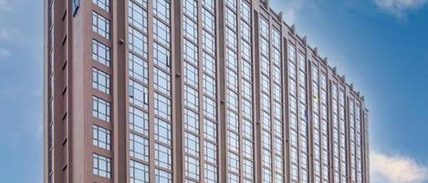 A tall building with a clear sky in the background.