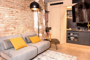 Classic Studio, 1 Queen Bed, Mobility Accessible | Living area | 50-inch flat-screen TV with cable channels, Netflix, streaming services - Coeo Despertar Signature Apartments (Málaga)