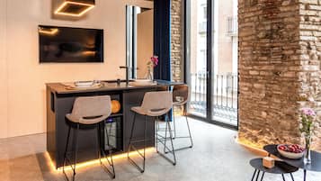 Ambassador One Bedroom Apartment | Private kitchen | Microwave, stovetop, toaster, cookware/dishes/utensils