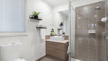 Shower, hair dryer, towels, soap