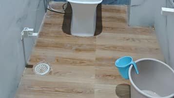 Shower, rainfall showerhead, slippers, towels