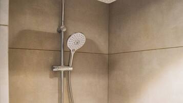 Deluxe Double Room | Bathroom | Hair dryer, slippers, towels, soap