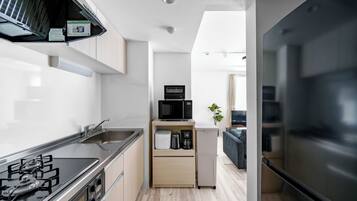 Apartment | Private kitchen | Fridge, microwave, stovetop, cookware/dishes/utensils