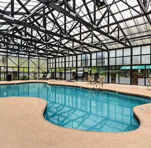 An indoor swimming pool with a clear view of the roof structure and surrounding area. - Hot Tub + Pool Access, Game Room | Mins to Dollywood | Grand Getaway Cabin (Sevierville)