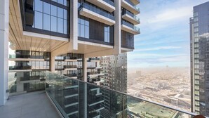 A high-rise building with multiple balconies, large windows, and a view of a cityscape. - Vogue | Al Wasl 1 Residence near World Trade Centre (Dubai)