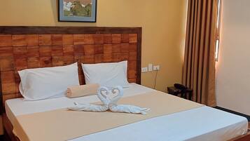 Desk, laptop workspace, blackout drapes, iron/ironing board