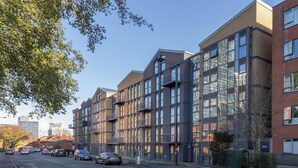 A multi-story residential building with a modern architectural design, featuring large windows and balconies. - A classy, cozy & modern apartment in Birmingham City centre. (Birmingham)