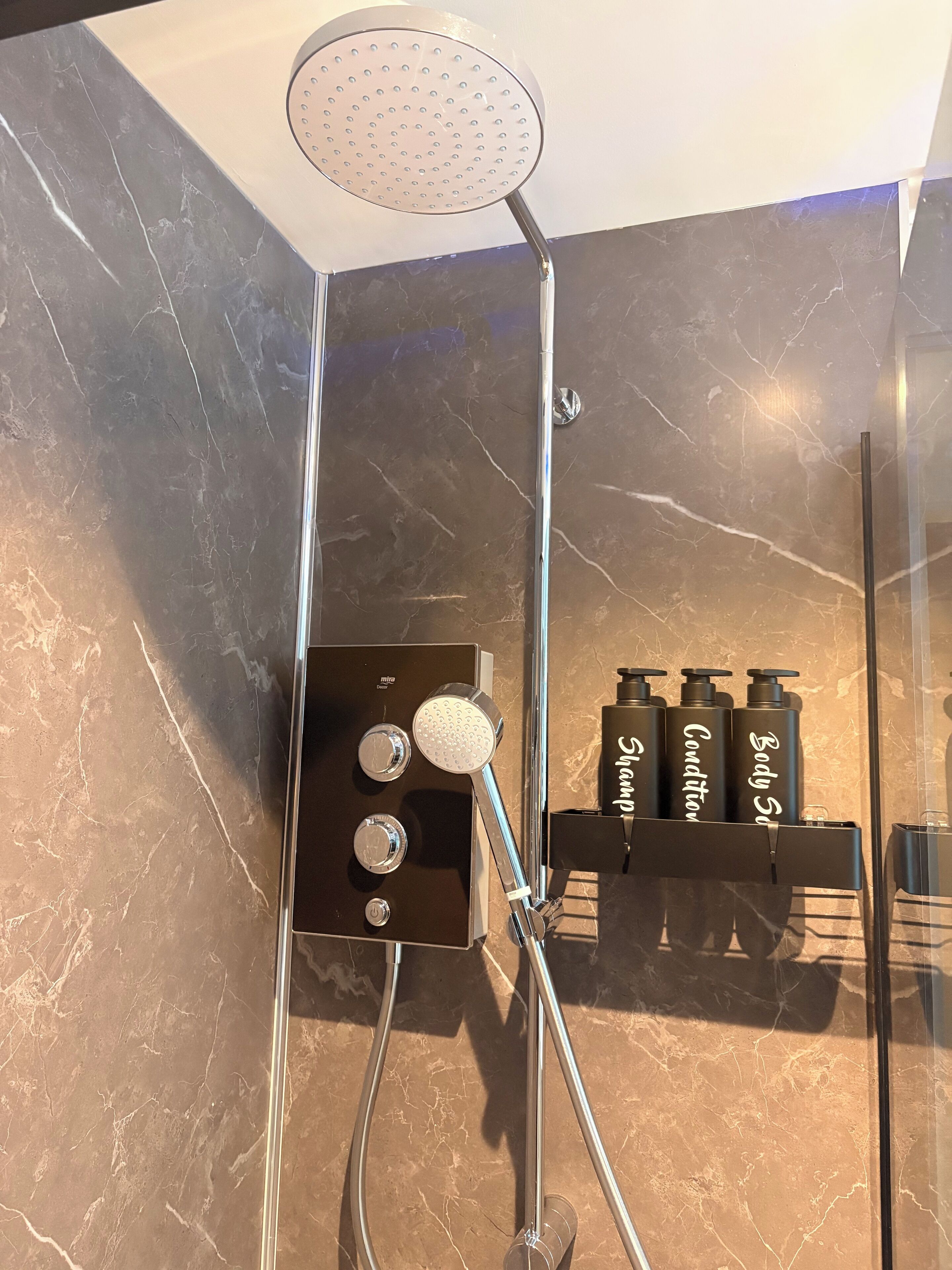 Shower, hair dryer, towels, soap