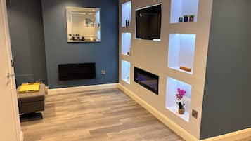 Smart TV, fireplace, books