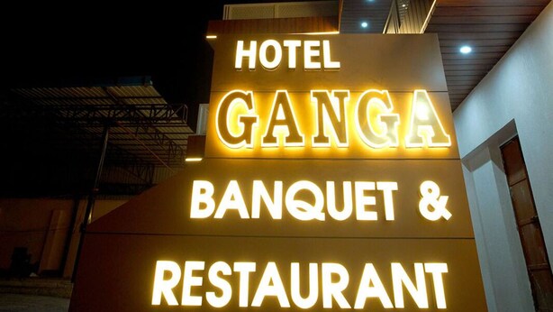 A sign for Hotel Ganga Banquet & Restaurant with illuminated lettering.