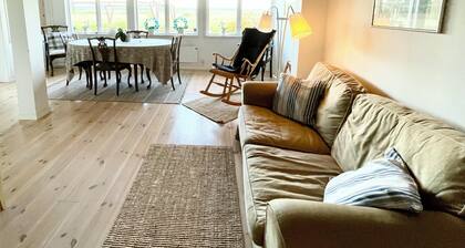 Seaside plot with private jetty, rowing boat & sunset