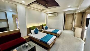Deluxe Twin Room, Balcony, City View | In-room safe, desk, laptop workspace, iron/ironing board