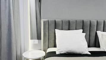 Departamento Deluxe, vista al patio | Artículos del minibar gratis, wifi gratis y ropa de cama