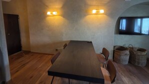 A conference room with a long table, chairs, and two wall-mounted lamps. - In Downtown Florence above Santa Croce, the most beautiful church, renovated 2026 (Firenze)