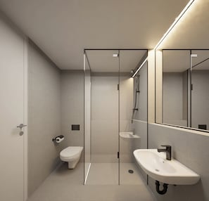 Un baño moderno con cabina de ducha de vidrio, inodoro y lavamanos.