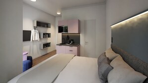 Un dormitorio moderno con cama, mesitas de noche, armario y electrodomésticos integrados.
