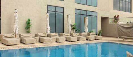 Outdoor pool, free cabanas, pool umbrellas