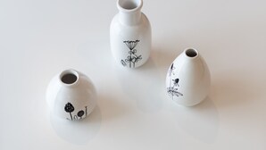 Three white ceramic vases with black floral designs on a white surface. - LIV - Comfortable Athens Studio S8-2c (Athens)