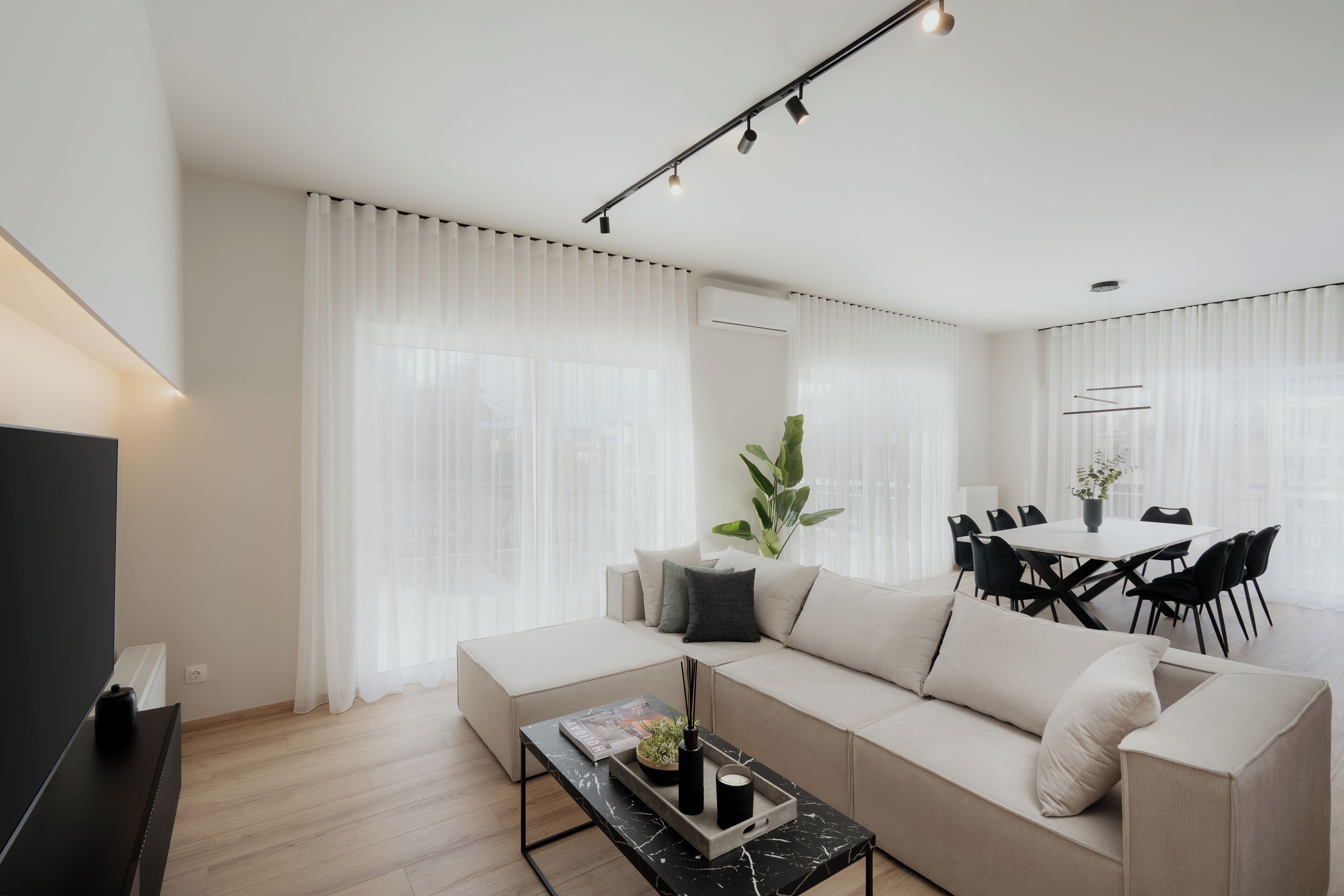 Luxury Apartment, City View | Living area | 42-inch TV with cable channels