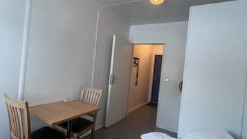 Desk, laptop workspace, blackout drapes, soundproofing