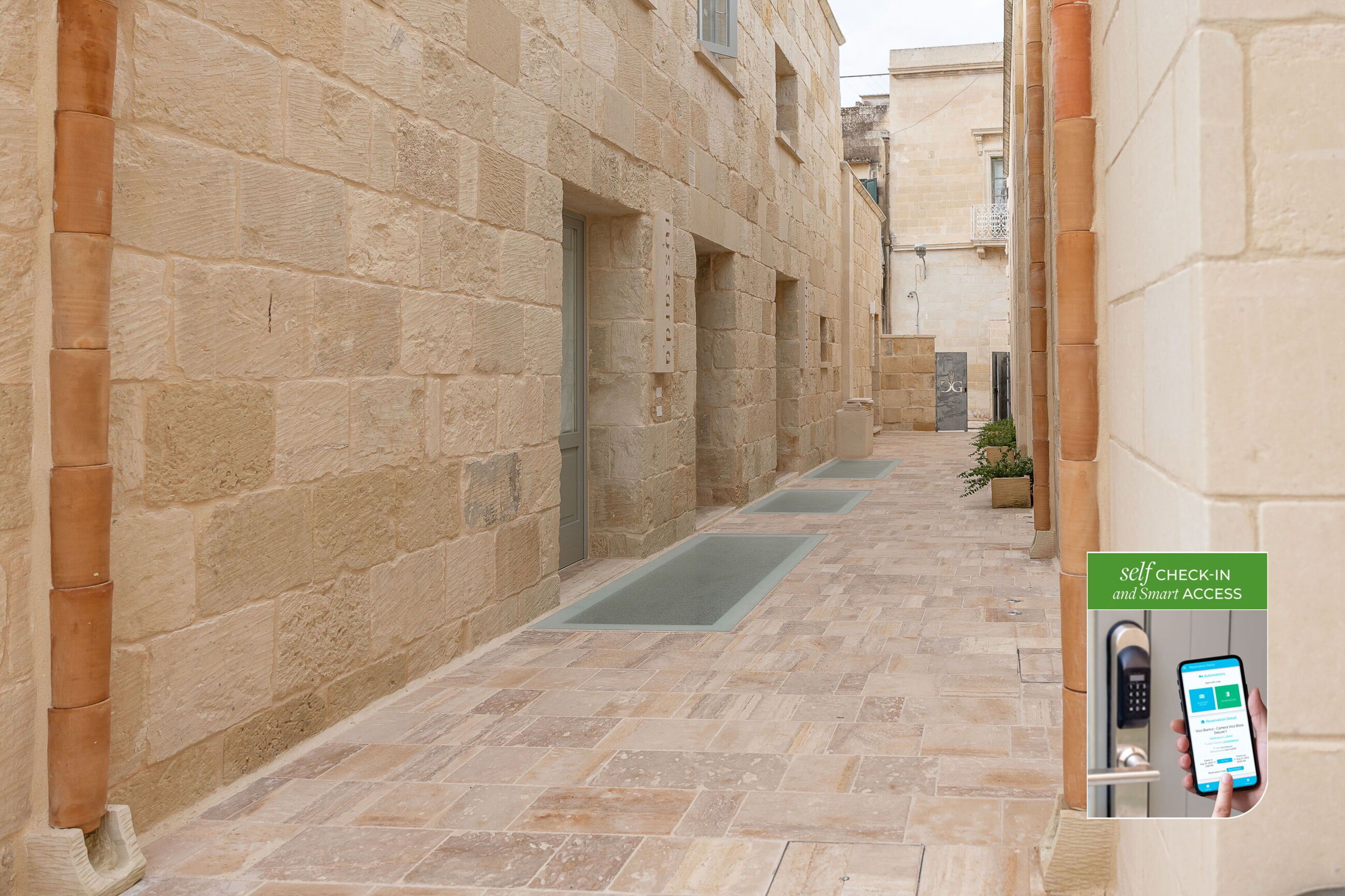 A narrow stone corridor with a self-check-in kiosk and a smartphone app interface.