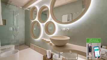 A modern bathroom with a large oval sink, multiple mirrors, and a self-check-in system.