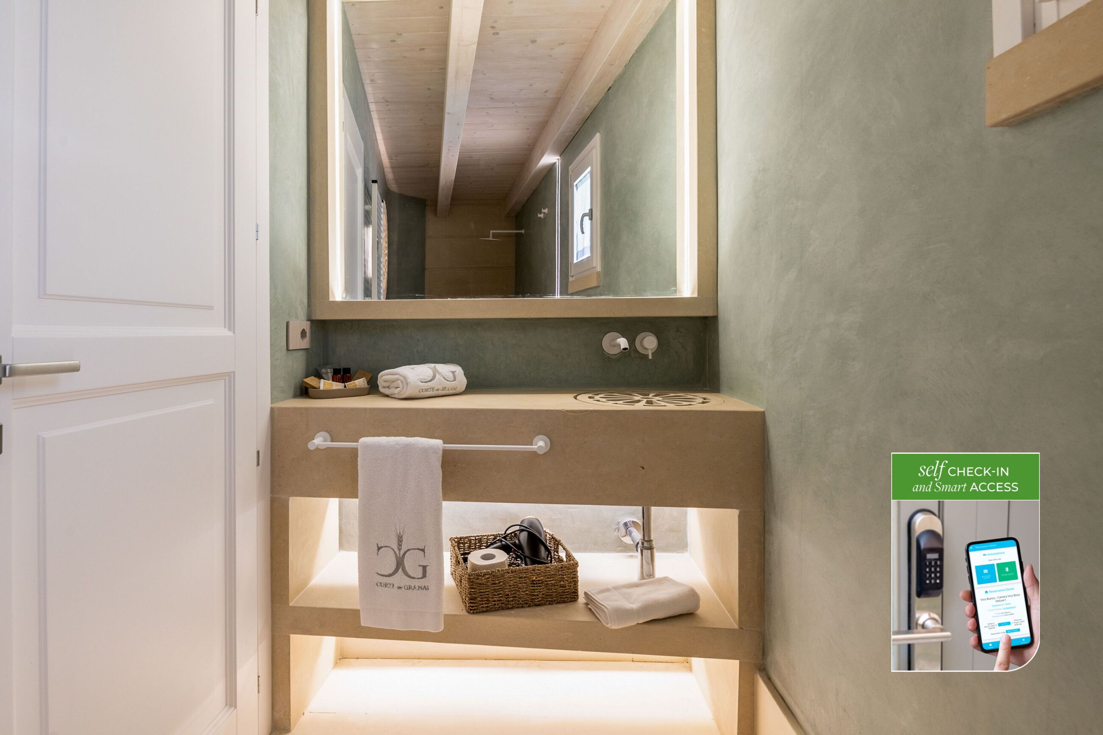 A modern bathroom with a wooden ceiling, a large mirror, a towel rack, and a self-check-in system.